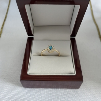 Złoty pierścionek z jasnoniebieską cyrkonią Markiza PM006/T